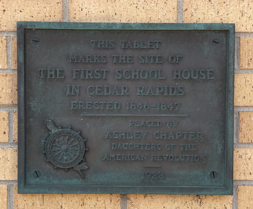 Plaque commemorating the first school house in Cedar Rapids. 1847 - 1855 