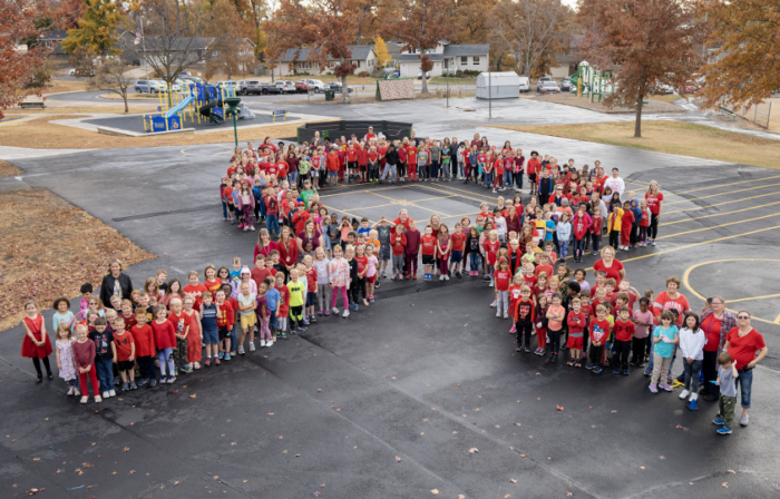 Pierce elementary students form a ribbon on the playground.