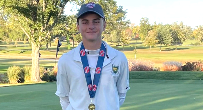 Reid Hall Kennedy top golfer image with medal.