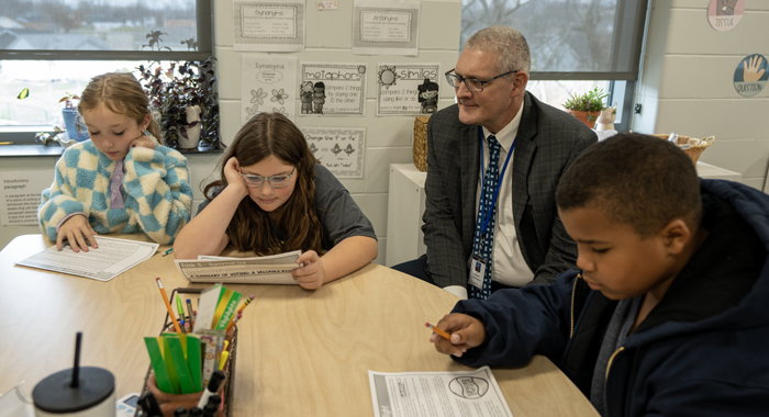 Interim Superintendent Art Sathoff learns with students.