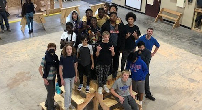 McKinley Math Class take a picture on their stairs creation.