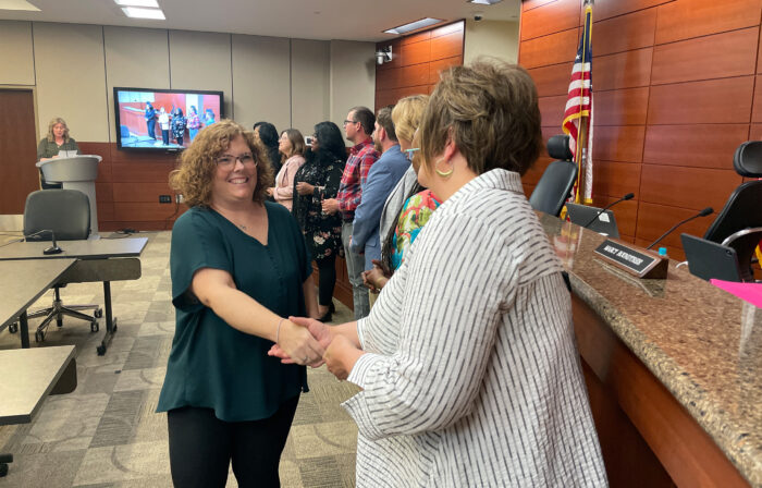 Employee honored by school board for years of service.