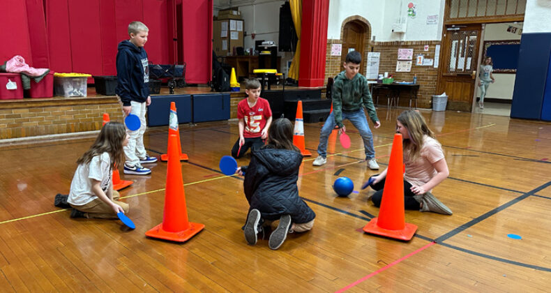 Students playing ball in Harrison Elementary Gym.