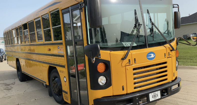 A school bus dropping kids off.