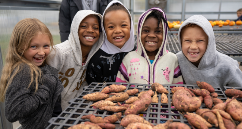 Students from Cedar River Academy visit an urban farm.